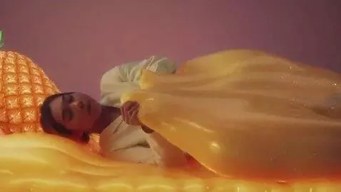 AI Video from prompt: A dreamy, surreal cinematic video of a young wom