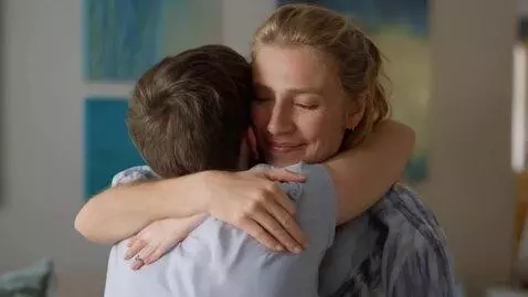 AI Video from prompt: a woman hugs and kisses a man