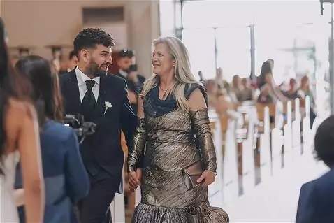 AI Video from prompt: The young man, having given his elderly mother  