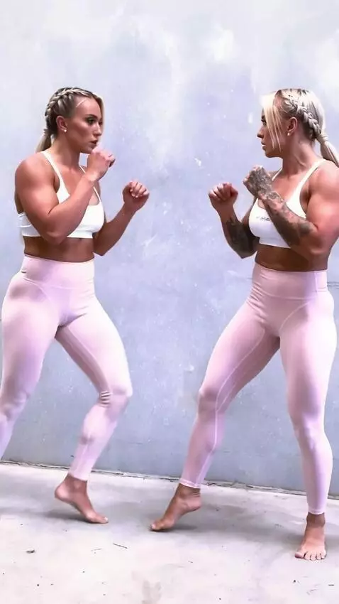 AI Video from prompt: A kickboxing girl fighting her double in the  ri