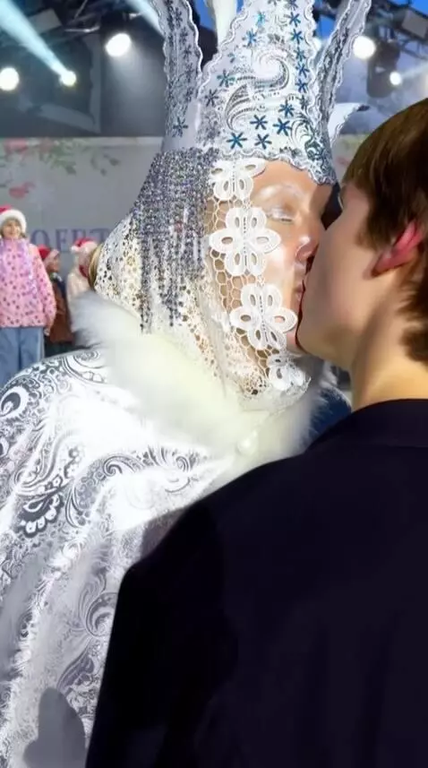 AI Video from prompt: The fifty-year-old snow queen kisses the young m