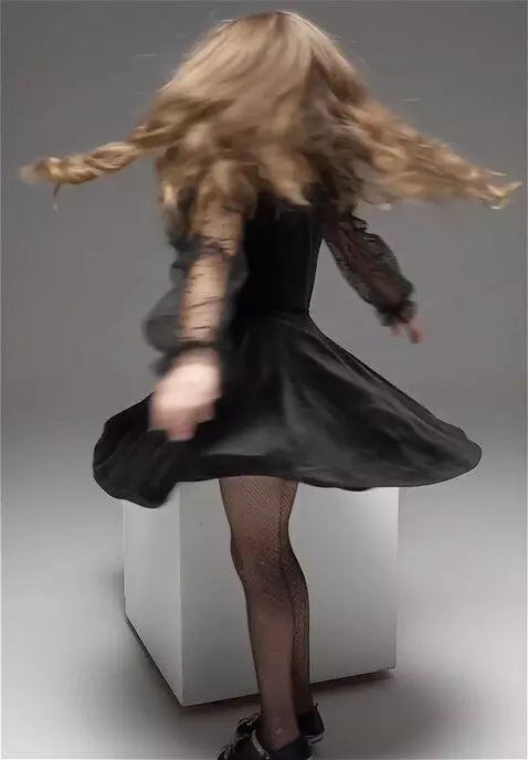 AI Video from prompt: she gets up and slowly spins around