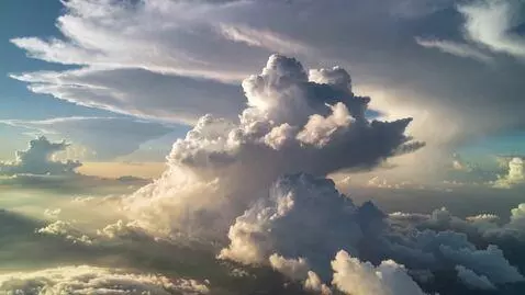 AI Video from prompt: A realistic daytime sky filled with soft, natura