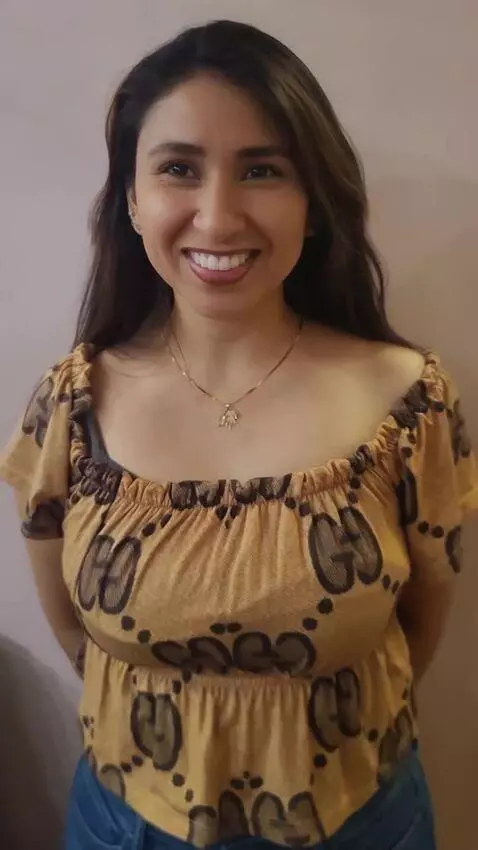 AI Video from prompt: she shows of her long pretty dark perfect shiny 