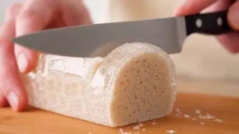 AI Video from prompt: cut the glass bread using knife. ASMR video