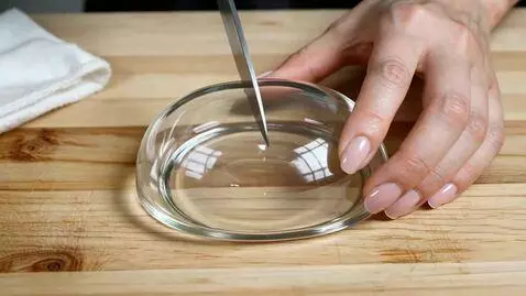 AI Video from prompt: cut the glass bread using knife. ASMR video