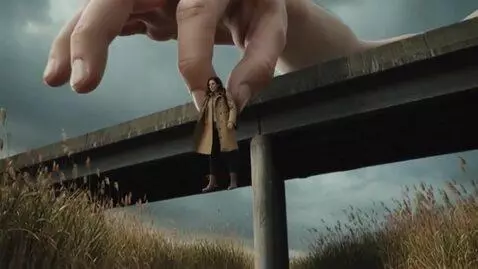 AI Video from prompt: A colossal, hyper-realistic human hand descends 