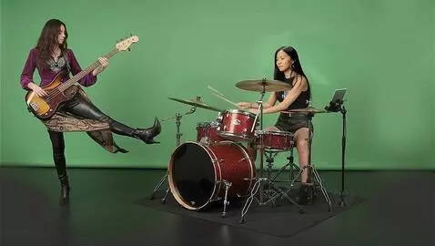 AI Video from prompt: the Bass player and the drummer play the song  1