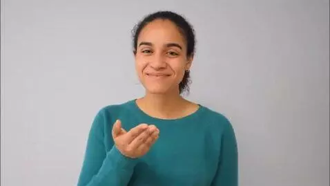 AI Video from prompt: Thank you sign language with person in plain bac