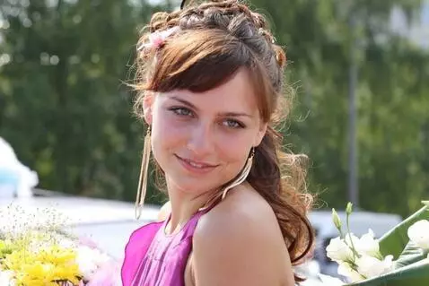 AI Video from prompt: A shy smile plays on the woman's lips as she app