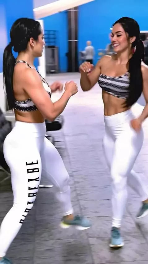 AI Video from prompt: a kickboxing girl fights her doppelganger in the
