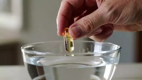 AI Video from prompt: Close-up shot of a real human hand holding a tra