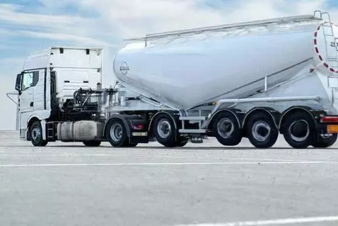 AI Video from prompt: Industrial logistics sequence at a ready-mix con