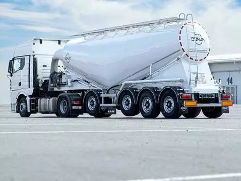 AI Video from prompt: Industrial logistics sequence at a ready-mix con