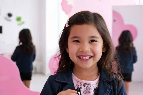 AI Video from prompt: an adorable girl with a bubbly personality playf