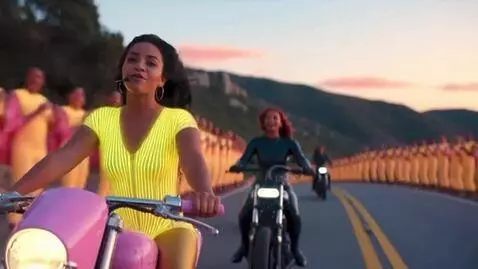 AI Video from prompt: A 20-year-old Cuban woman is riding a pink motor