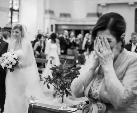 AI Video from prompt: An elderly woman stands at the altar  waiting fo