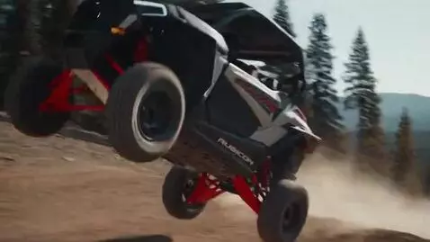 AI Video from prompt: Gray Red Rubicon ATV doing extreme off-road stun