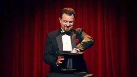 AI Video from prompt: A magician pulls a rabbit from his top hat