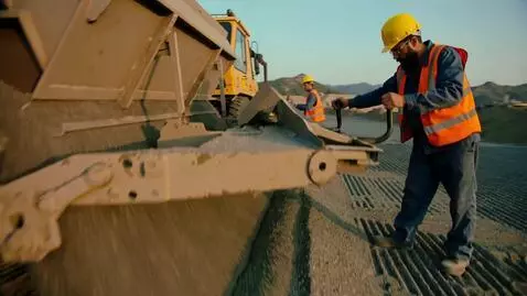 AI Video from prompt: "5-second cinematic video. Workers spreading lim