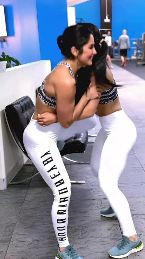 AI Video from prompt: A female wrestler fights her doppelganger and kn