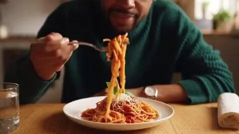 AI Video from prompt: an person eating spaghetti