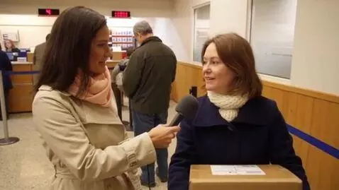 AI Video from prompt: A female journalist approaches a woman standing 