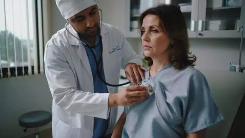 AI Video from prompt: In the hospital, the doctor lifts the woman's to