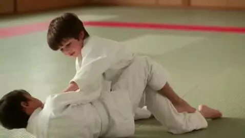 AI Video from prompt: Two boys at six years,wearing judo jackets,white