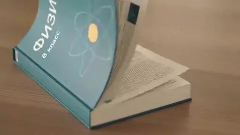 AI Video from prompt: An 8th grade physics textbook is shown on a tabl