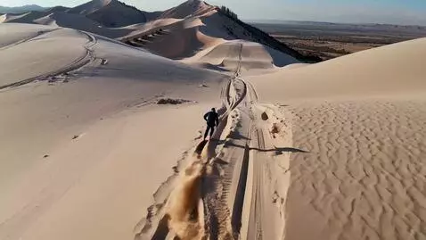 AI Video from prompt: skiing down sand dunes in Middle east