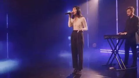 AI Video from prompt: A 25-year-old Russian guy plays a synthesizer wh