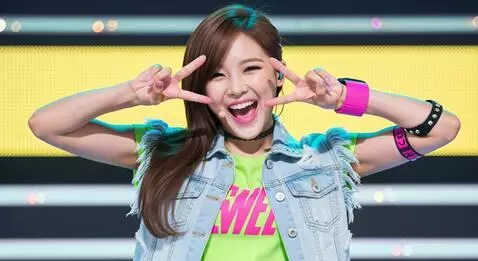 AI Video from prompt: Ending fairy pose: double V sign with giggle.
