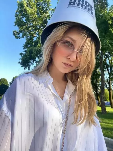 AI Video from prompt: A girl is walking through the park when suddenly