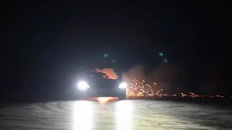 AI Video from prompt: Black background with light car driving drifting