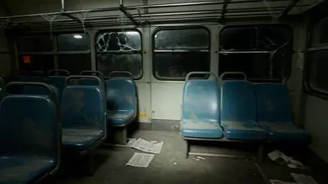 AI Video from prompt: I'm exploring an abandoned bus at night in a fir