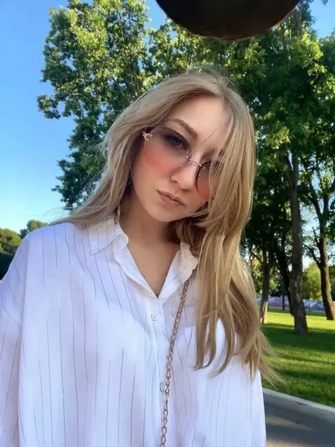 AI Video from prompt: A girl is walking through the park when suddenly