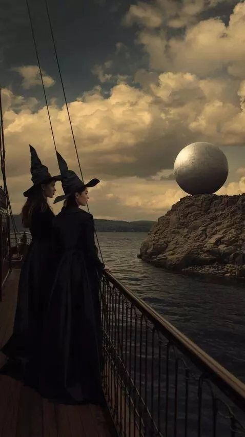 AI Video from prompt: A steamboat sails along a river. Two witches on 