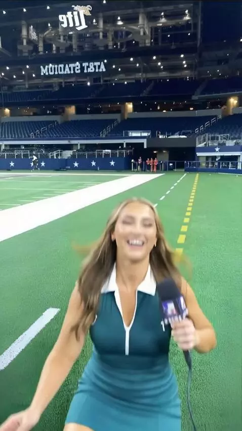 AI Video from prompt: A girl is reporting when a football hits her in 