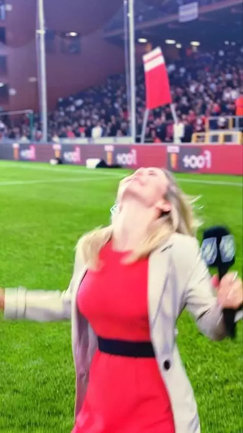 AI Video from prompt: A girl is reporting when a football hits in the 