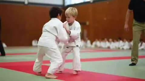 AI Video from prompt: two boys at six years,wearing white judo jackets