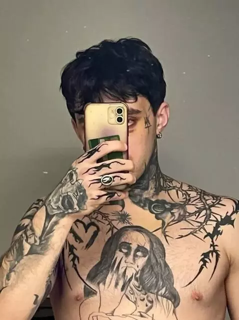 AI Video from prompt: Remove all tattoos from this person's body witho