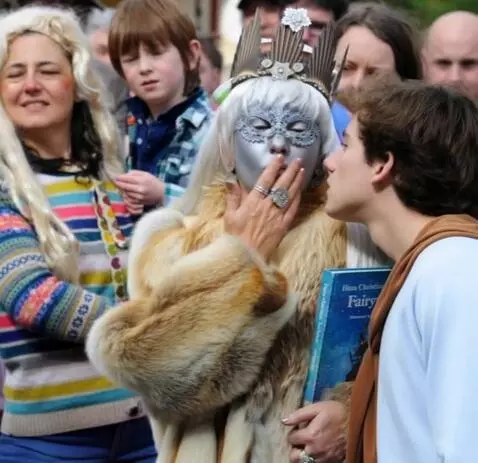 AI Video from prompt: a fifty-year-old snow queen kisses a young man o