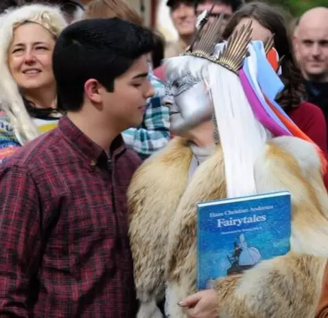 AI Video from prompt: A fifty-year-old snow queen kisses a young man o