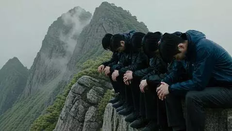 AI Video from prompt: Men sitting on the mountain edge crying in in ra