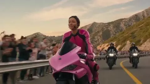 AI Video from prompt: A 30-year-old Dominican woman is riding a pink m