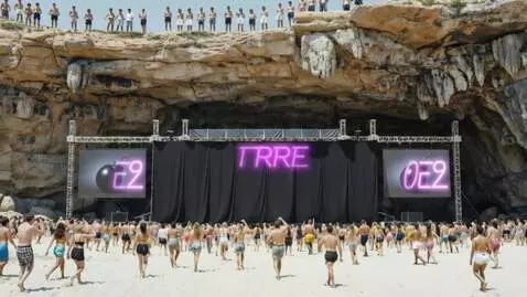 AI Video from prompt: The people on the beach walking towards front of