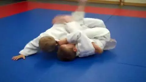AI Video from prompt: Two boys at six years,wearing judo jackets,white