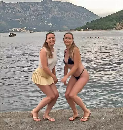 AI Video from prompt: The women turn to the camera and squat down, cro