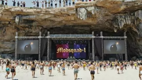 AI Video from prompt: back curtain with the letters that spell "MODSQU